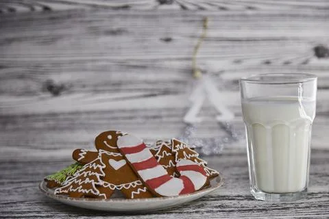 Table setting of handmade baking cookies and warm glass of milk on the wooden Stock Photos