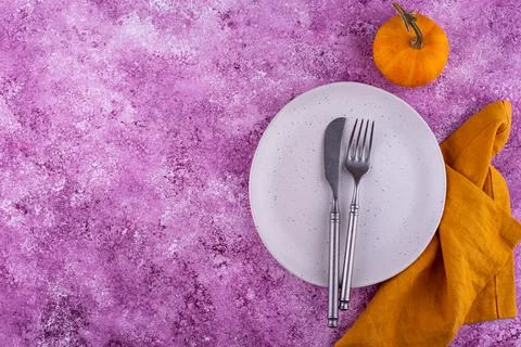 Table setting on lilac concrete background Stock Photos