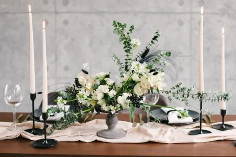 Table setting at a luxury wedding and Beautiful flowers in a vase on the tabl Stock Photos