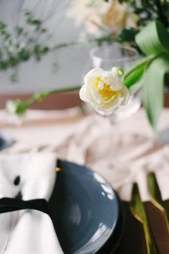 Table setting at a luxury wedding and Beautiful flowers in a vase on the tabl Stock Photos
