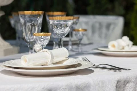 Table setting with napkin and win glasses Stock Photos