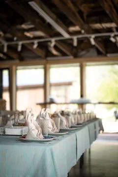 Table setting with napkins in light colors in cafe Stock Photos