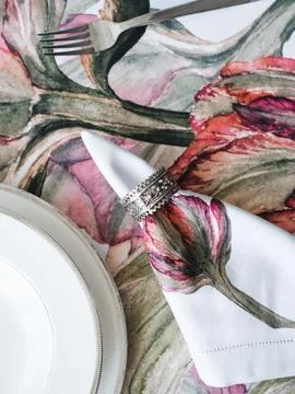 Table setting napkins with red flowers Stock Photos