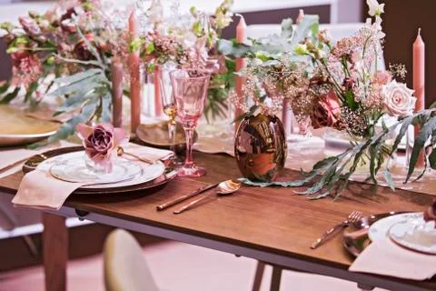 Table setting in pink color, for a wedding or other event, wine glasses, plat Stock Photos