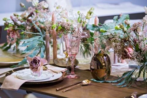 Table setting in pink color, for a wedding or other event, wine glasses, plat Stock Photos