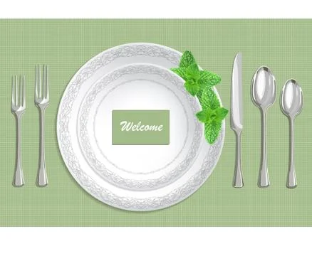 Table setting with plate, spoon, knife and fork on a green fabric background Illustrazione stock