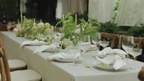 Table setting with plates, glasses for special occasions and weddings Stock Footage 306150345