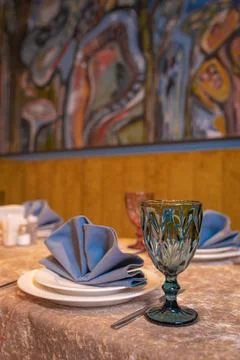 Table setting in the restaurant for evening guests. white dishes , napkins an Stock Photos