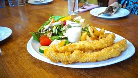 Table setting in restaurant, Fresh salad plate Stock Footage 73997232