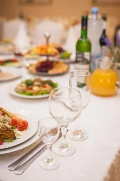 Table setting in a restaurant. Glasses for drinks Stock Photos