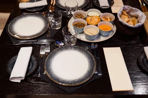 Table setting in restaurant. Stock Photos