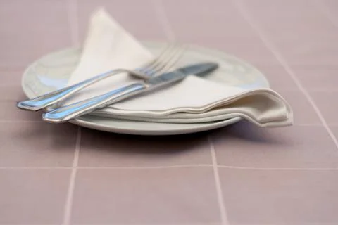 Table setting in a restaurant with reserved card. Stock Photos