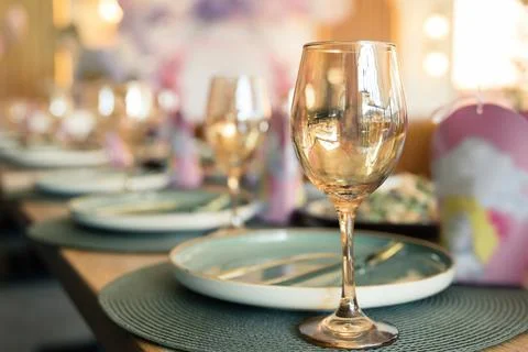 Table setting in a restaurant in rose gold warm colors Stock Photos