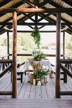 Table setting for a romantic dinner. Beautiful flowers in a vase on the table Stock Photos