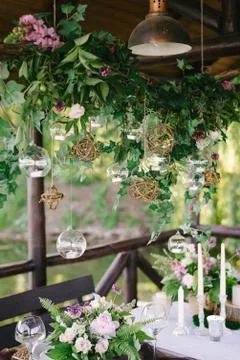 Table setting for a romantic dinner. Beautiful flowers in a vase on the table Stock Photos