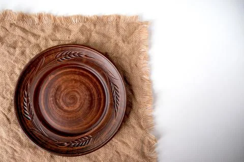 Table setting in Russian style and a ceramic plate on a brown table. Stock Photos