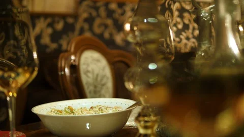 Table setting served. Plates, wine, glasses, cutlery. Christmas dinner family. Stock Footage 129044725