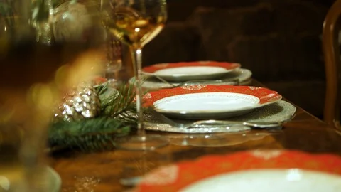 Table setting served. Plates, wine, glasses, cutlery. Christmas dinner family. Stock Footage 129045053