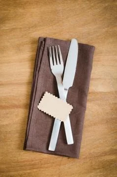 Table Setting. Silverware with Empty Tag on Linen Napkin. Stock Photos