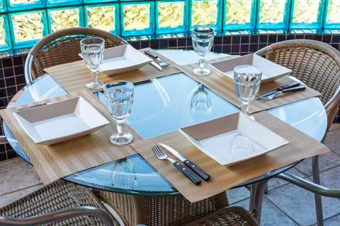 Table setting for simple lunch in restaurant Stock Photos