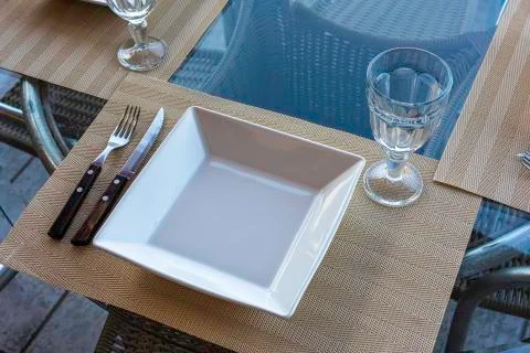 Table setting for simple lunch in restaurant Stock Photos