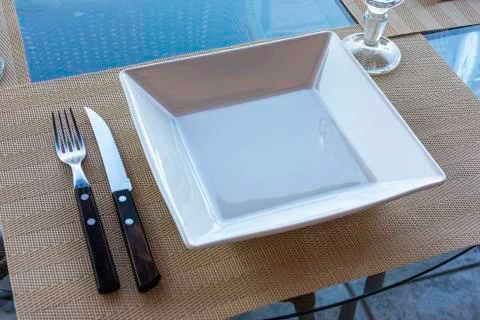 Table setting for simple lunch in restaurant Stock Photos