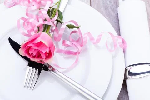 Table setting with a single pink rose Stock Photos