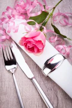 Table setting with a single pink rose Stock Photos