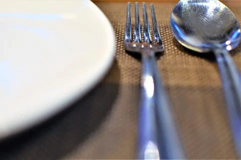 A table setting with spoon and fork Stock Photos