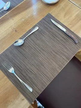 Table setting with spoon, fork and knife in a restaurant Stock Photos
