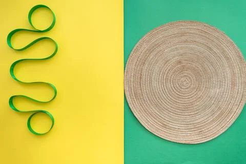 Table setting with table mat and dinnerware with green and yellow background. Stock Photos
