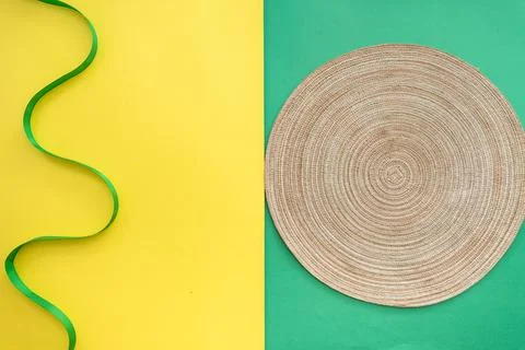 Table setting with table mat and dinnerware with green and yellow background. Stock Photos