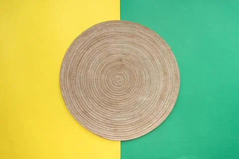 Table setting with table mat and dinnerware with green and yellow background. Stock Photos