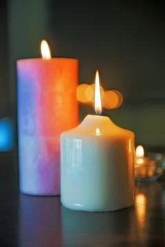 Table setting of two alight wax candles Stock Photos