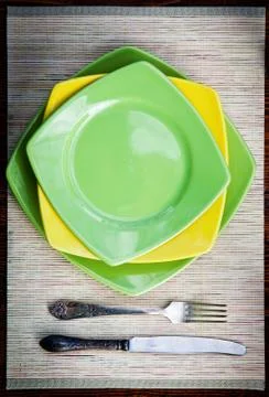 Table setting for two with empty plates - rustic wooden table Stock Photos