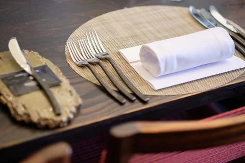 Table setting with utensils set following the etiquette Stock Photos