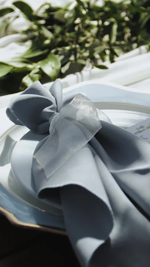 Table setting for a wedding, empty plate with tablecloth on the table in a Stock Footage 322527011