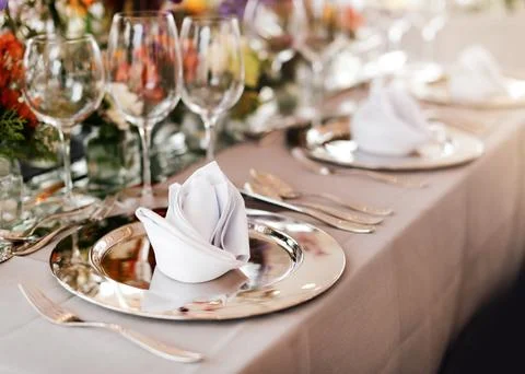 Table setting for a wedding or dinner event, with flowers Stock Photos