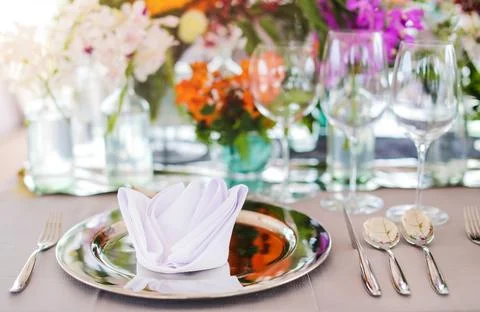 Table setting for a wedding or dinner event, with flowers Stock Photos