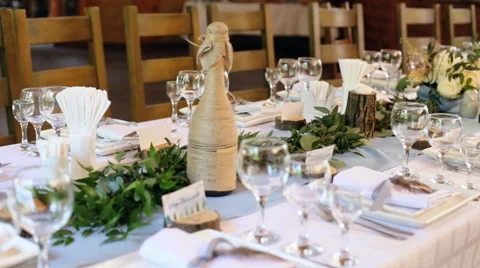 Table setting at wedding. Steampunk style. Glasses. plates, cutlery on craft Stock Footage 65502805