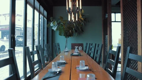 Table setting with wooden long tables and chairs Stock Footage 126204951