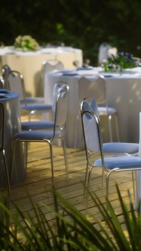 Table setup for gathering in outdoor setting during daytime event Stock Footage 335963851