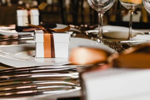 Table setup with gift box, wedding guest table, reception layout Stock Photos