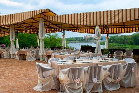 Table setup at hotel restaurant Stock Photos