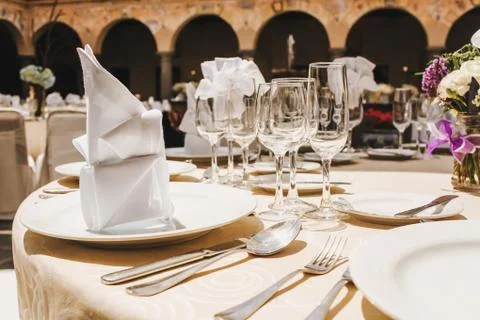 Table setup, wedding guest table, reception layout rustic background Stock Photos