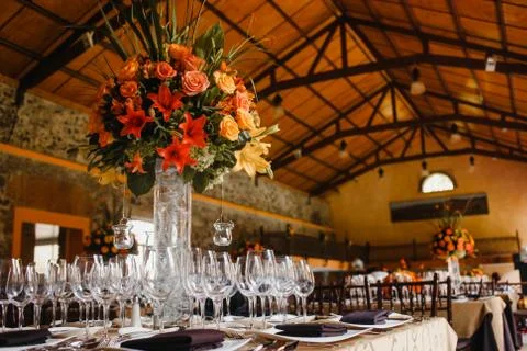 Table setup, wedding guest table, reception layout in pantone living coral Stock Photos