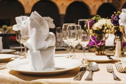 Table setup, wedding guest table, reception layout rustic background Stock Photos