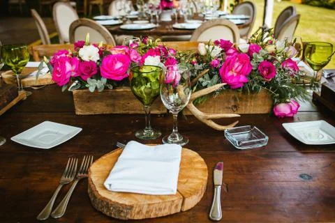 Table setup, wedding guest table, reception layout in pantone living coral Stock Photos