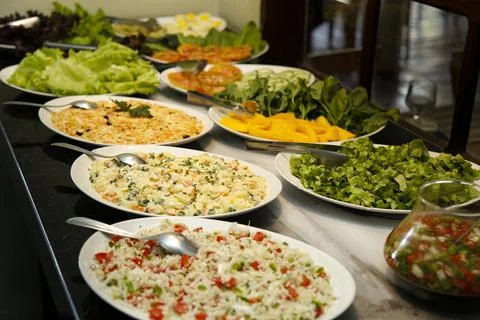 Table with several salad plates Stock Photos