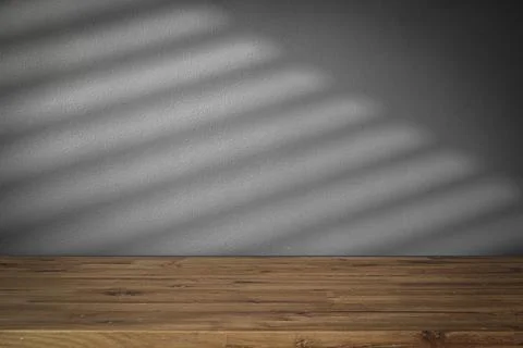 Table shadow background. Wooden table and white empty wall with plant shadows. Stock Photos